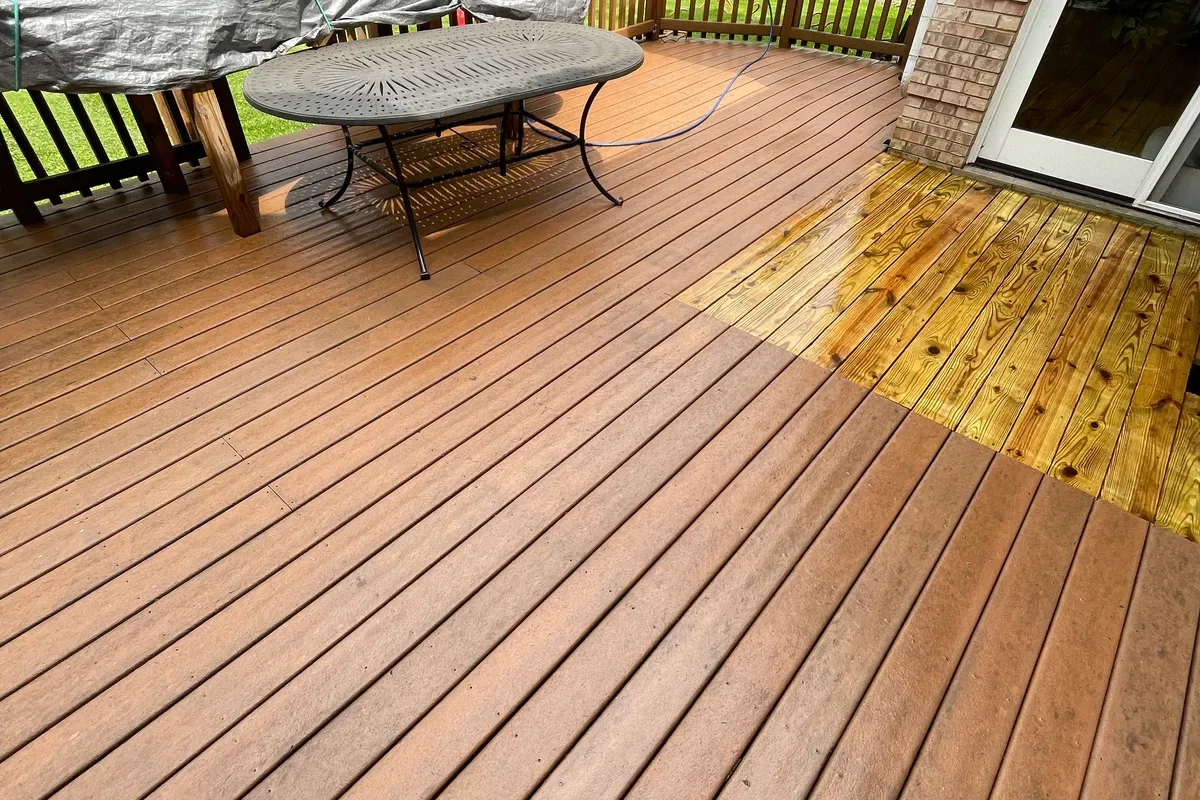 Wood deck during and after power washing, cleaned boards showing their natural color